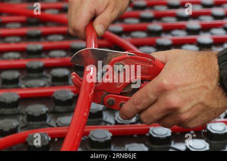 Water underfloor heating systems installation, work in progress on construction site for a flat residence building Stock Photo