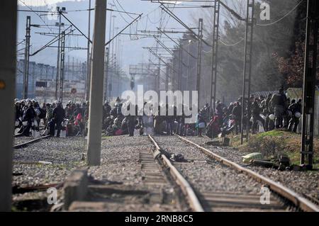 Afghan migrants protest and stand behind the wire fencing at the closed Greek-Macedonian border, near the Macedonian city of Gevgelija on Feb. 23, 2016. Macedonia has confirmed that it only allowed Syrian and Iraqi refugees through, matching a decision by its northern neighbor, Serbia. Around 5,000 migrants were waiting at the border wishing to continue their journey across Macedonia, Serbia, Croatia, Slovenia and then Austria, with Germany the final goal for most. MACEDONIA-GEVGELJA-MIGRANTS Biljana, PUBLICATIONxNOTxINxCHN   Afghan Migrants Protest and stand behind The Wire fencing AT The Clo Stock Photo