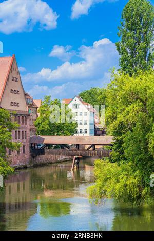 Scenic view of Henkersteg, a picturesque wooden bridge over the River Pegnitz built in 1595 in Nuremberg Old City, Germany. Stock Photo