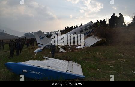 (160227) -- KALIKOT, Feb. 26, 2016 -- People gather around the crash-landing site of 9N-AJB plane of Air Kasthamandap in Kalikot district in far western Nepal, Feb. 26, 2016. Two pilots were killed when the 9N-AJB plane of Air Kasthamandap, carrying nine passengers and two crew members on board, crash landed in the remote district of Kalikot while enroute to Jumla district from Nepalgunj, after failing to land at Jumla airport due to some technical glitches. )(dh) NEPAL-KALIKOT-PLANE-CRASH LANDING-SITE SorajxShahi PUBLICATIONxNOTxINxCHN   Feb 26 2016 Celebrities gather Around The Crash Landing Stock Photo