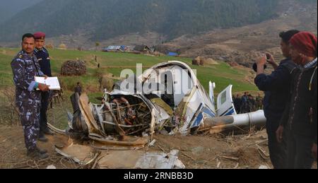 (160227) -- KALIKOT, Feb. 26, 2016 -- Police officials record the details at the crash-landing site of 9N-AJB plane of Air Kasthamandap in Kalikot district in far western Nepal, Feb. 26, 2016. Two pilots were killed when the 9N-AJB plane of Air Kasthamandap, carrying nine passengers and two crew members on board, crash landed in the remote district of Kalikot while enroute to Jumla district from Nepalgunj, after failing to land at Jumla airport due to some technical glitches. )(dh) NEPAL-KALIKOT-PLANE-CRASH LANDING-SITE SorajxShahi PUBLICATIONxNOTxINxCHN   Feb 26 2016 Police Officials Record T Stock Photo