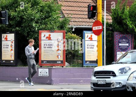 (160302) -- WELLINGTON, Mar. 2, 2016 -- A resident walks past the posters of the upcoming referendum to decide New Zealand s national flag in Wellington, New Zealand, on March 2, 2016. New Zealand will this month decide their national flag in a postal referendum that will be the culmination of months of polarizing and sometimes bitter debate. In the referendum, voters will choose between the current flag and a new design emerged as the winner of an initial referendum late last year. ) (CORRECTION)NEW ZEALAND-WELLINGTON-NATIONAL FLAG-REFERENDUM SuxLiang PUBLICATIONxNOTxINxCHN   Wellington Mar 2 Stock Photo