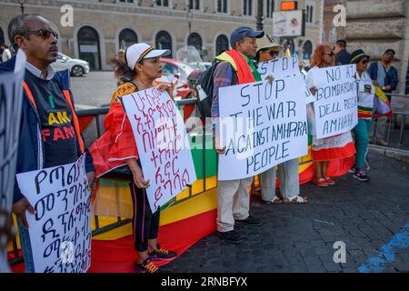 Rome, Italy. 31st Aug, 2023. Ethiopian men and women of the Amhara ethnic group hold up placards calling for the end of the persecution against the Amhara people during the protest demonstration against the persecution against the Amhara in Ethiopia which took place in Rome.According to the United Nations High Commissioner for Human Rights (OHCHR), at least 183 people have been killed in clashes in the Amhara region. After the proclamation of the state of emergency at least 1,000 people were arrested: many belonging to the Amhara ethnic group and suspected of supporting the Fano militias ('vo Stock Photo