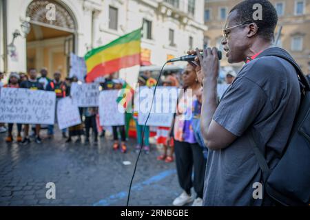 Rome, Italy. 31st Aug, 2023. An Ethiopian man of Amhara ethnicity speaks into the microphone during the protest demonstration against the persecution of Amhara people in Ethiopia which took place in Rome. According to the United Nations High Commissioner for Human Rights (OHCHR), at least 183 people have been killed in clashes in the Amhara region. After the proclamation of the state of emergency at least 1,000 people were arrested: many belonging to the Amhara ethnic group and suspected of supporting the Fano militias ('voluntary fighters' in Amharic) who refuse to be absorbed into the feder Stock Photo