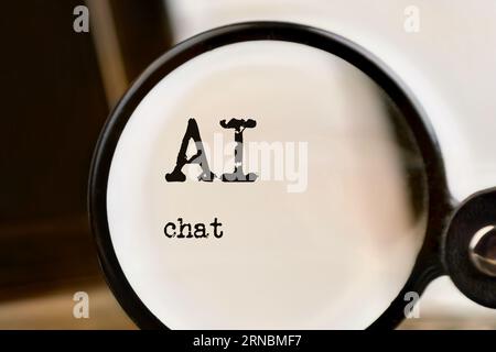 AI chat technology demonstrated with laptop, text and magnifying glass. Command Prompt. Chat with artificial intelligence. Stock Photo