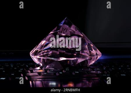 AI, artificial intelligence the new diamond of information technology, colorful image with closeup of laptop and diamond Stock Photo