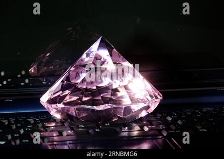 AI, artificial intelligence the new diamond of information technology, colorful image with closeup of laptop and diamond Stock Photo