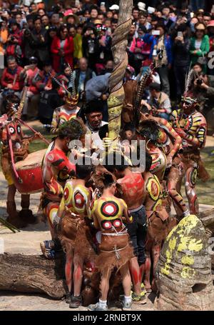 (160311) -- MILE, March 11, 2016 -- People of Yi ethnic group present their ancestors way to start a hand drill fire during the annual fire worshipping festival, which falls on the third day of the second month in the Chinese lunar calendar at Xiyi Township under Mile City, southwest China s Yunnan Province, March 11, 2016. ) (yxb) CHINA-YUNNAN-YI ETHNIC GROUP-FIRE WORSHIPPING FESTIVAL(CN) LinxYiguang PUBLICATIONxNOTxINxCHN   Mile March 11 2016 Celebrities of Yi Ethnic Group Present their ancestors Way to Start a Hand Drill Fire during The Annual Fire Worshiping Festival Which Falls ON The Thi Stock Photo