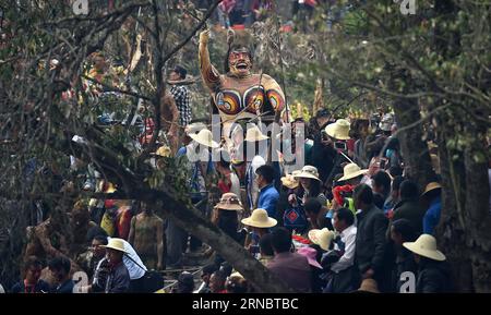 (160311) -- MILE, March 11, 2016 -- The god of fire is carried into the venue of local Yi people s annual fire worshipping festival, which falls on the third day of the second month in the Chinese lunar calendar at Xiyi Township under Mile City, southwest China s Yunnan Province, March 11, 2016. ) (yxb) CHINA-YUNNAN-YI ETHNIC GROUP-FIRE WORSHIPPING FESTIVAL(CN) LinxYiguang PUBLICATIONxNOTxINxCHN   Mile March 11 2016 The God of Fire IS carried into The Venue of Local Yi Celebrities S Annual Fire Worshiping Festival Which Falls ON The Third Day of The Second Month in The Chinese Lunar Calendar A Stock Photo