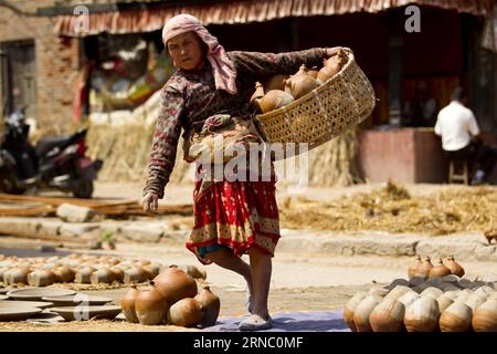 (160316) -- BHAKTAPUR, March 16, 2016 -- A Nepalese woman works at a pottery square in Bhaktapur, Nepal, March 16, 2016. Bhaktapur is an ancient Newar community town and is well known for its pottery work. ) NEPAL-BHAKTAPUR-POTTERY PratapxThapa PUBLICATIONxNOTxINxCHN   Bhaktapur March 16 2016 a Nepalese Woman Works AT a Pottery Square in Bhaktapur Nepal March 16 2016 Bhaktapur IS to Ancient Newar Community Town and IS Well known for its Pottery Work Nepal Bhaktapur Pottery PratapxThapa PUBLICATIONxNOTxINxCHN Stock Photo