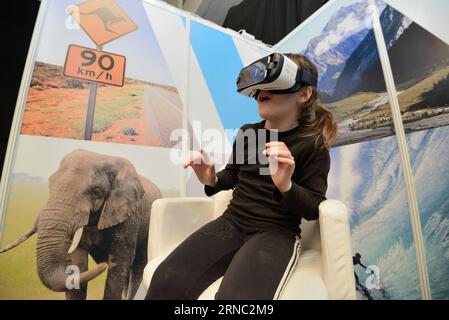 (160319) -- ZAGREB, March 19, 2016 -- A girl experiences virtual reality traveling during the 5th Place2go International Tourism Fair in Zagreb, capital of Croatia, March 19, 2016. A total of 160 exhibitors from 20 countries took part in the fair which kicked off on Friday. ) CROATIA-ZAGREB-INTERNATIONAL TOURISM FAIR MisoxLisanin PUBLICATIONxNOTxINxCHN   Zagreb March 19 2016 a Girl Experiences Virtual Reality Traveling during The 5th  International Tourism Fair in Zagreb Capital of Croatia March 19 2016 a total of 160 exhibitors from 20 Countries took Part in The Fair Which kicked off ON Frida Stock Photo