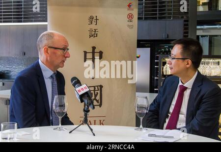 (160404) -- SYDNEY, April 4, 2016 -- Managing Director and third generation winemaker from Taylors Wines Mitchell Taylor (L) receives an interview with Xinhua in Sydney, Australia, March 24, 2016. Australian wines are becoming increasingly popular overseas, with the Chinese market growing considerably over the past few years. Statistics from Wine Australia show exports to China increased by 66 percent in 2015, to 370 million Australian dollars, with red wine by far the drink of choice. Managing Director and third generation winemaker from Taylors Wines Mitchell Taylor told Xinhua his company h Stock Photo