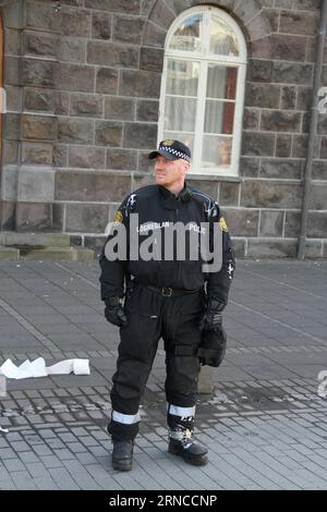 REYKJAVIK, April 4, 2016 -- Yogurt thrown by protestors is seen on a policeman s uniform during a protest in front of the parliament building in Reykjavik, capital of Iceland, on April 4, 2016. Thousands of Icelanders gathered in front of the parliament on Monday evening to express their anger against the government following the release of the so-called Panama Papers , which suggest Icelandic prime minister Sigmundur David Gunnlaugsson and other two cabinet members have ties to offshore companies. ) ICELAND-REYKJAVIK- PANAMA PAPERS -PROTEST XiexBinbin PUBLICATIONxNOTxINxCHN   Reykjavik April Stock Photo