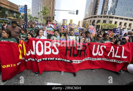 (160415) -- LOS ANGELES, April 14, 2016 -- Thousands of workers, including those in the fast-food, home care and child care industries, hold a protest, demanding a nationwide $15-an-hour minimum wage April 14, 2016 in Los Angeles, the United States. ) U.S.-LOS ANGELES-PROTEST ZhaoxHanrong PUBLICATIONxNOTxINxCHN   160415 Los Angeles April 14 2016 thousands of Workers including Those in The Almost Food Home Care and Child Care Industries Hold a Protest demanding a nation $ 15 to hour Minimum Wage April 14 2016 in Los Angeles The United States U S Los Angeles Protest ZhaoxHanrong PUBLICATIONxNOTx Stock Photo