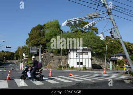 (160417) -- KUMAMOTO, April 17, 2016 -- Damaged public facilities are seen in the earthquake rocked Mashiki in Kumamoto prefecture, Japan, April 17, 2016. A powerful magnitude-7.3 earthquake struck the island of Kyushu in southwestern Japan early Saturday just a day after a sizable foreshock hit the region, with the number of fatalities now standing at 41 according to the latest figures on Sunday. ) (djj) JAPAN-KUMAMOTO-EARTHQUAKE-AFTERMATH MaxPing PUBLICATIONxNOTxINxCHN   160417 Kumamoto April 17 2016 damaged Public Facilities are Lakes in The Earthquake Rocked Mashiki in Kumamoto Prefecture Stock Photo