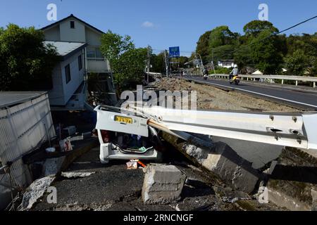 (160417) -- KUMAMOTO, April 17, 2016 -- Destroyed houses and public facilities are seen in the earthquake rocked Mashiki in Kumamoto prefecture, Japan, April 17, 2016. A powerful magnitude-7.3 earthquake struck the island of Kyushu in southwestern Japan early Saturday just a day after a sizable foreshock hit the region, with the number of fatalities now standing at 41 according to the latest figures on Sunday. ) (djj) JAPAN-KUMAMOTO-EARTHQUAKE-AFTERMATH MaxPing PUBLICATIONxNOTxINxCHN   160417 Kumamoto April 17 2016 destroyed Houses and Public Facilities are Lakes in The Earthquake Rocked Mashi Stock Photo