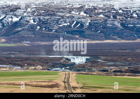 Crowds of tourists at Goðafoss waterfall, north Iceland. Mass tourism is becoming a significant problem even in the remoter parts of the country Stock Photo
