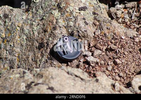 Canon Lens cap lost on the side of mountain . High quality photo Stock Photo