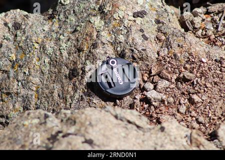 Canon Lens cap lost on the side of mountain . High quality photo Stock Photo