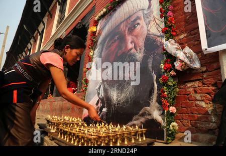 (160429) -- KATHMANDU, April 29, 2016 -- A woman performs religious rituals to offer prayers during the last funeral procession of Nepali famous actor Thinle Lhondup in Kathmandu, Nepal, April 29, 2016. Thinle Lhondup was famous because of his performance in the film Himalaya directed by renowned French director Eric Valli. The film was nominated for Oscar Award for Best Foreign Language Film in 1999. ) NEPAL-KATHMANDU-ACTOR-FUNERAL SunilxSharma PUBLICATIONxNOTxINxCHN   160429 Kathmandu April 29 2016 a Woman performs Religious Ritual to OFFER Prayers during The Load Funeral Procession of Nepal Stock Photo