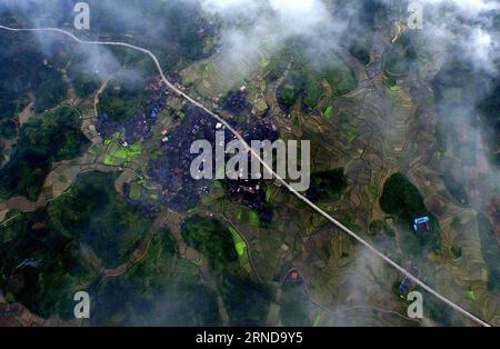 (160512) -- SANJIANG, May 12, 2016 -- This photo taken with unmanned aerial vehicle on May 9, 2016 shows the Nanzhai Village in Liangkou Township of Sanjiang Dong Autonomous County, south China s Guangxi Zhuang Autonomous Region. Sanjiang Dong Autonomous County, located in the north of Guangxi, is renowned in the world for its large numbers of drum towers, wind and rain bridges and traditional buildings of Dong ethnic group. ) (zwx) CHINA-GUANGXI-SANJIANG-SCENERY (CN) HuangxXiaobang PUBLICATIONxNOTxINxCHN   Sanjiang May 12 2016 This Photo Taken With Unmanned Aerial Vehicle ON May 9 2016 Shows Stock Photo