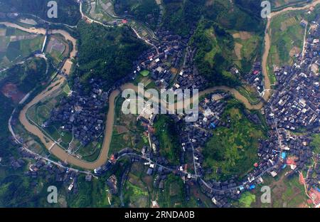 (160512) -- SANJIANG, May 12, 2016 -- This photo taken with unmanned aerial vehicle on May 7, 2016 shows Linxi Township of Sanjiang Dong Autonomous County, south China s Guangxi Zhuang Autonomous Region. Sanjiang Dong Autonomous County, located in the north of Guangxi, is renowned in the world for its large numbers of drum towers, wind and rain bridges and traditional buildings of Dong ethnic group. ) (zwx) CHINA-GUANGXI-SANJIANG-SCENERY (CN) HuangxXiaobang PUBLICATIONxNOTxINxCHN   Sanjiang May 12 2016 This Photo Taken With Unmanned Aerial Vehicle ON May 7 2016 Shows Linxi Township of Sanjiang Stock Photo