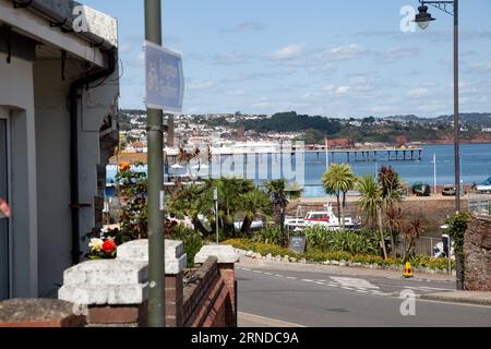 A view of a beach and a pier at a sunny day in Paignton, UK Stock Photo