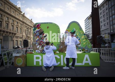 People make a three-dimensional mural with recyclable materials to design the letters BA , in an event to mark the World Recycling Day in Buenos Aires, Argentina, May 17, 2016. The city of Buenos Aires celebrated on Tuesday the World Recycling Day, with activities that included the making of a mural with recovered materials to design the letters BA , which identify the Argentine capital. The initiative was led by the Ministry of Environment and Public Space and aimed at raising awareness of the importance of separating waste at source. Martin Zabala) (cyc) ARGENTINA-BUENOS AIRES-COMMEMORATION- Stock Photo