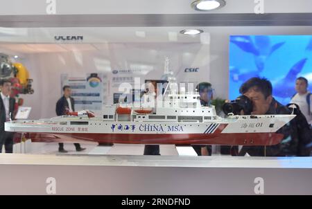 (160519) -- BEIJING, May 19, 2016 -- Visitors look at a model of a China marine patrol boat at the 19th China Beijing International High-tech Expo, in Beijing, capital of China, May 19, 2016. ) (wyl) CHINA-BEIJING-HIGH-TECH EXPO (CN) LixWen PUBLICATIONxNOTxINxCHN   160519 Beijing May 19 2016 Visitors Look AT a Model of a China Navy Patrol Boat AT The 19th China Beijing International High Tech EXPO in Beijing Capital of China May 19 2016 wyl China Beijing High Tech EXPO CN LixWen PUBLICATIONxNOTxINxCHN Stock Photo