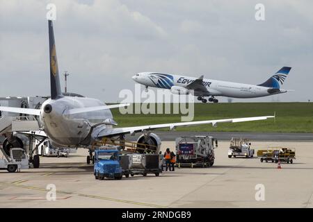 (160519)-- PARIS, May 19, 2016 -- Photo taken on May 19, 2016 shows an airplane of EgyptAir taking off at the Charles de Gaulle Airport, in Paris, France. Egypt s Foreign Ministry confirmed to Egyptian Civil Aviation Ministry that wreckages of the missing airplane were found near the Greek Island of Karpathos, EgyptAir said on Thursday. Earlier in the day, EgyptAir said the missing plane, an Airbus A320, disappeared from radar screens en route from Paris to Cairo Thursday at 2:45 am Cairo local time (0045 GMT), with 66 people aboard. ) FRANCE-PARIS-EGYPTAIR-MISSING AIRPLANE PierrexAndrieu PUBL Stock Photo