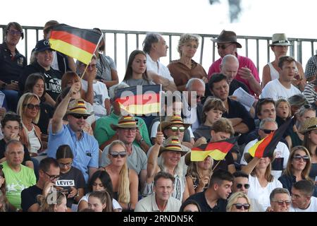 Mailand, Italy. 01st Sep, 2023. Equestrian sport: European Championship, show jumping, 3rd competition, 2nd round Nations Cup (individual and team). Fans of the German team wave their flags. Credit: Friso Gentsch/dpa/Alamy Live News Stock Photo