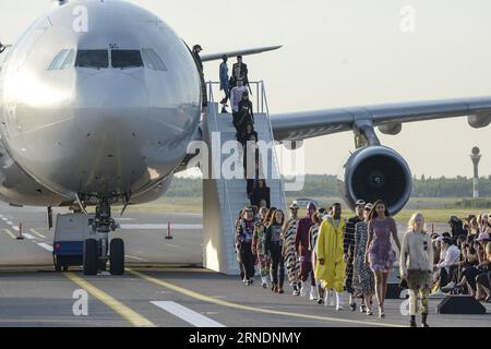 Models displayed the latest collection during the Ultimate Runway Fashion Show at Helsinki Airport, Finland, on May 24, 2016. A unique fashion show was held on Tuesday night at the Runway 2 of Helsinki Airport, which was transformed into a catwalk and enabled seven designers from China, Korea, Japan, the UK, Sweden, Denmark and Finland to present their collections. ) FINLAND-HELSINKI-AIRPORT FASHION SHOW SergeixStepanov PUBLICATIONxNOTxINxCHN   Models displayed The Latest Collection during The Ultimate Runway Fashion Show AT Helsinki Airport Finland ON May 24 2016 a Unique Fashion Show what He Stock Photo