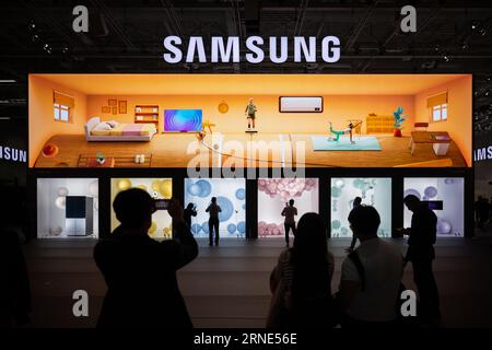 Berlin, Germany. 01st Sep, 2023. Visitors stand at the entrance to the Samsung booth during the International Consumer Electronics Fair (IFA) at Messe Berlin. Exhibitors have been showing off their new products at the Funkausstellung in Berlin since 1924. Credit: Sebastian Christoph Gollnow/dpa/Alamy Live News Stock Photo