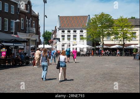 Weert, Limburg, The Netherlands, July 14, 2023 - People walking over the historical old market square of the village Stock Photo