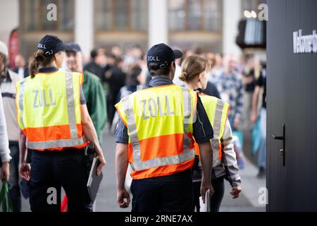 Berlin, Germany. 01st Sep, 2023. Customs employees walk through a hall during the International Consumer Electronics Fair (IFA) at Messe Berlin. Exhibitors have been showing off their new products at the Funkausstellung in Berlin since 1924. Credit: Sebastian Christoph Gollnow/dpa/Alamy Live News Stock Photo