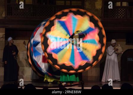 (160614) -- CAIRO, June 13, 2016 -- Egyptian dancers perform the Tanoura, an Egyptian version of Sufi Dance, at a night show during the holy fasting month of Ramadan, at Al Ghouri Palace in Cairo, Egypt, June 13, 2016. ) EGYPT-CAIRO-RAMADAN-SUFI DANCE MengxTao PUBLICATIONxNOTxINxCHN   160614 Cairo June 13 2016 Egyptian Dancers perform The Tanoura to Egyptian Version of Sufi Dance AT a Night Show during The Holy fasting Month of Ramadan AT Al Ghouri Palace in Cairo Egypt June 13 2016 Egypt Cairo Ramadan Sufi Dance MengxTao PUBLICATIONxNOTxINxCHN Stock Photo