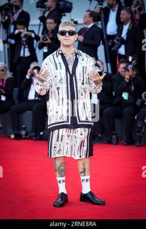 Venice, Italy. 30th Aug, 2023. Lazza attends the opening red carpet at the 80th Venice International Film Festival on August 30, 2023 in Venice, Italy. (Photo by Daniele Cifala/NurPhoto) Credit: NurPhoto SRL/Alamy Live News Stock Photo