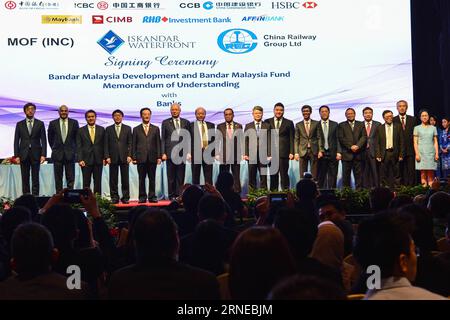 (160617) -- KUALA LUMPUR, June 17, 2016 -- Malaysian Prime Minister Najib Razak (6th,L) poses for a group photo with guests after a signing ceremony of the Bandar Malaysia project in Kuala Lumpur, Malaysia, June 17, 2016. Chinese leading banks and company on Thursday expressed their support for a flagship project in the Malaysian capital, which will also house the terminal of the proposed high speed rail linking Kuala Lumpur and Singapore. Bank of China, the Industrial and Commercial Bank of China and China Construction Bank will join hands with HSBC and several leading local banks to provide Stock Photo