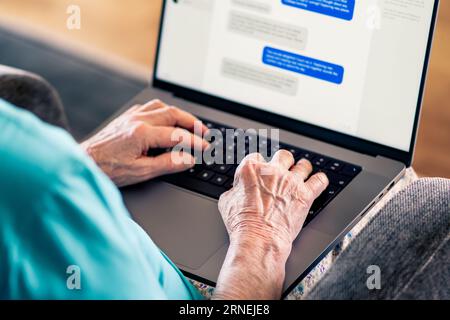 Old woman and online romance scam. Love and money fraud on internet. Elder senior using computer. Fake profile and catfish on dating website. Stock Photo