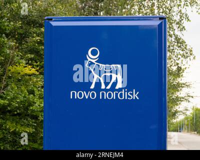 Signpost with logotype at Novo Nordisk corporate headquarters. A pharmaceutical company headquartered in Denmark. Copenhagen, Denmark - august 12, 202 Stock Photo