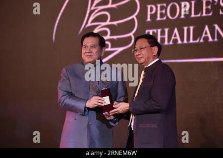 (160628) -- BANGKOK, June 27, 2016 -- Tanasak Patimapragorn (L), Deputy Prime Minister of Thailand, awards the trophy of the most popular destination in Thailand in the eyes of Chinese tourists to a delegate of Chiang Mai, during the awarding ceremony of 2016 people s choice awards in Bangkok, capital of Thailand, on June 27, 2016. The Tourism Authority of Thailand (TAT) Monday announced 17 favorites in Thailand voted by Chinese mainland tourists, including tourist attractions, hotels, activities, foods and shopping destinations. ) THAILAND-BANGKOK- 2016 PEOPLE S CHOICE AWARDS-AWARDING CEREMON Stock Photo