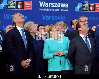 (160708) -- WARSAW, July 8, 2016 -- NATO Secretary General Jens Stoltenberg(L, front), German Chancellor Angela Merkel(C, front) and French President Francois Hollande(R, front) watch the air show during the opening ceremony of the NATO summit in Warsaw, Poland on July 8, 2016. The NATO summit kicked off here Friday afternoon, with Polish President Andrzej Duda and NATO Secretary General Jens Stoltenberg officially greeting participants at the National Stadium PGE. ) POLAND-WARSAW-NATO-SUMMIT ShixZhongyu PUBLICATIONxNOTxINxCHN   160708 Warsaw July 8 2016 NATO Secretary General Jens Stoltenberg Stock Photo