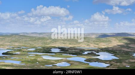 (160711) -- XINING, July 11, 2016 -- Photo taken on July 31, 2014 shows lakes in Madoi County of Tibetan Autonomous Prefecture of Golog, northwest China s Qinghai Province, . Over the past decade, lots of efforts have been devoted to rehabilitate the fragile eco-system of Sanjiangyuan and the ecological degrading has been basically curbed. However, there are still problems ranging from overlapping authority, weak law enforcement, lack of public awareness and a conflict between ecological protection and people s need for higher incomes. The Sanjiangyuan National Park has experienced system refo Stock Photo