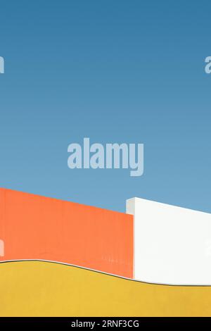 Colorful shape of building wall against blue sky, abstract minimalist architecture Stock Photo