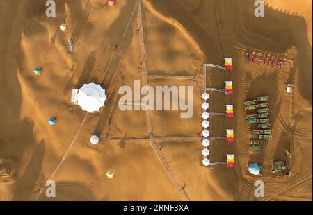 (160717) -- ORDOS, July 15, 2016 -- The starting point of sightseeing vehicles is seen at the Whistling Dune Bay in Dalad Qi in Ordos, north China s Inner Mongolia Autonomous Region, July 15, 2016. Located in the east of Kubuqi Desert, the Whistling Dune Bay was developed as a tourist destination since 1984. After years of improvement, it became a landmark for tourism industry of the Inner Mongolia Autonomous Region. ) (zhs) CHINA-INNER MONGOLIA-ORDOS-DESERT TOURISM (CN) LianxZhen PUBLICATIONxNOTxINxCHN   160717 Ordos July 15 2016 The Star Point of Sightseeing VEHICLES IS Lakes AT The whistlin Stock Photo