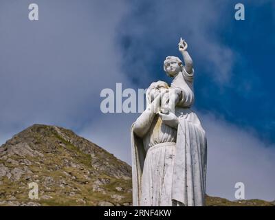 The white statue of Our Lady of the Sea near the top of the hill of Heaval on the island of Barra in the Outer Hebrides, Scotland, UK. Taken on a sunn Stock Photo