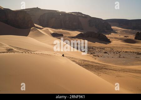 view in the Sahara desert of Tadrart rouge tassili najer in Djanet City  ,Algeria.colorful orange sand, rocky mountains Stock Photo