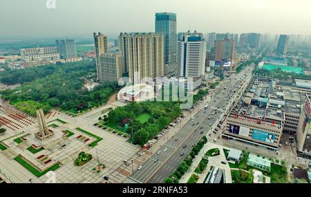 (160727) -- TANGSHAN, July 27, 2016 -- Photo taken on July 25, 2016 shows an aerial view of buildings near the Earthquake Monument in downtown Tangshan, north China s Hebei Province. In the early hours of July 28, 1976, one of the deadliest earthquakes of the 20th century toppled Tangshan, killing more than 240,000 people and injuring another 160,000. The deadly earthquake leveled Tangshan in just 23 seconds, with 96 percent of the city s architecture generally destroyed. Yet Tangshan has been building a miracle on its debris ever since. By the year 2015, the per capita gross national product Stock Photo