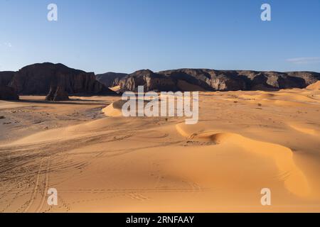 view in the Sahara desert of Tadrart rouge tassili najer in Djanet City  ,Algeria.colorful orange sand, rocky mountains Stock Photo