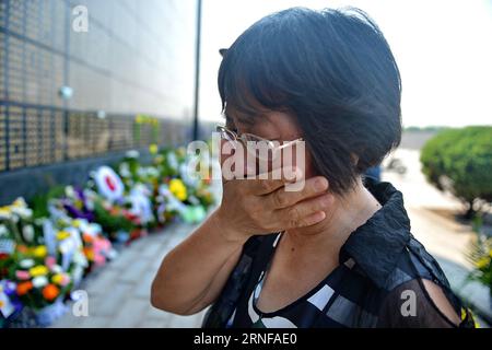 (160728) -- TANGSHAN, July 28, 2016 -- A woman mourns for victims of the 1976 Tangshan earthquake in front of a memorial wall in Tangshan, north China s Hebei Province, July 28, 2016. Local residents came to the Tangshan Earthquake Ruins Memorial Park on Thursday to mark the 40th anniversary of the devastating earthquake that killed their family members and friends. )(wsw) CHINA-HEBEI-TANGSHAN-EARTHQUAKE-COMMEMORATION (CN) MouxYu PUBLICATIONxNOTxINxCHN   160728 Tang Shan July 28 2016 a Woman mourns for Victims of The 1976 Tang Shan Earthquake in Front of a Memorial Wall in Tang Shan North Chin Stock Photo